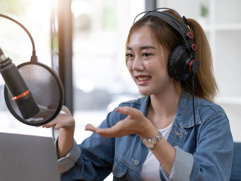 beautiful-asian-young-woman-radio-host-working-setting-microphone-preparing-to-speak-before.jpg