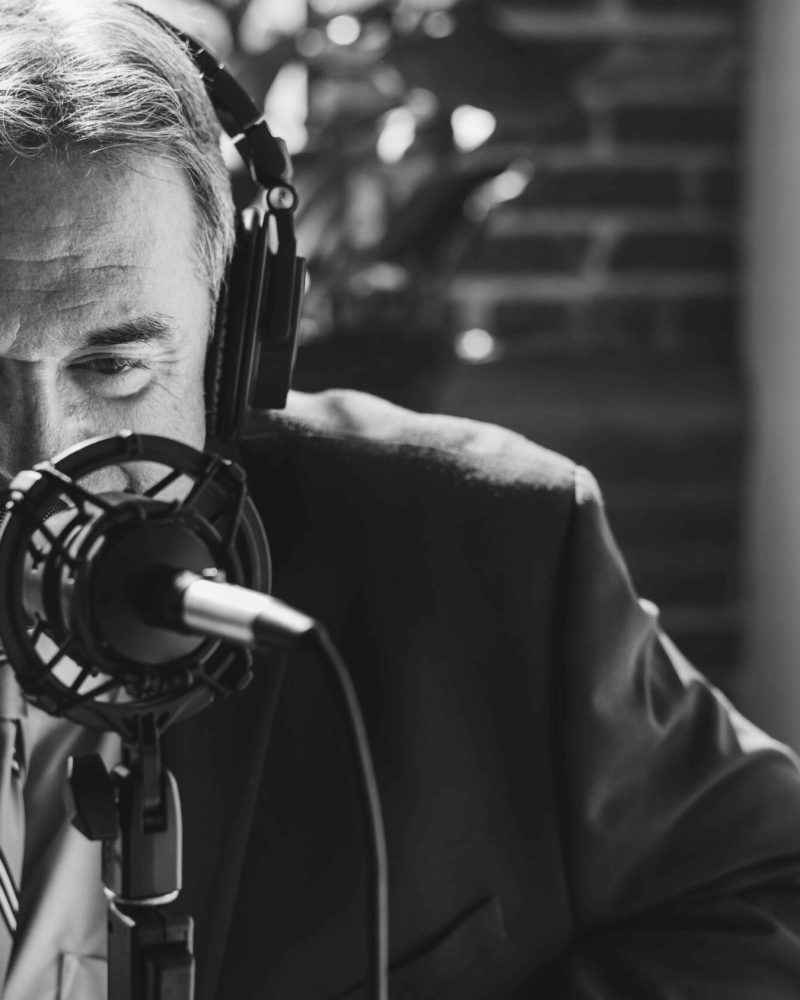 businessman-recording-a-podcast-2023-11-27-05-19-44-utc-min